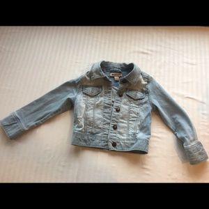 Distressed blue jean jacket